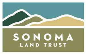 Sonoma Land Trust logo with stylized mountain and land graphic in green, beige, and dark green colors.